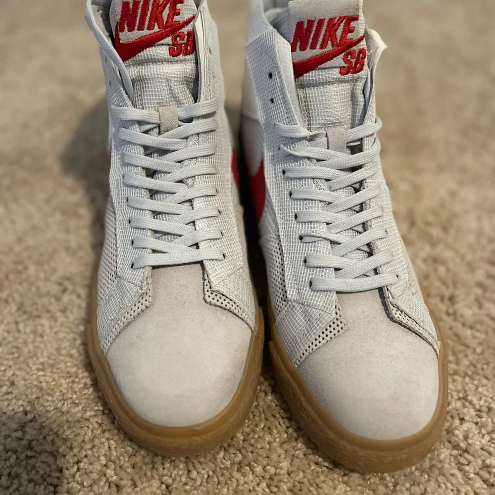 Nike High-Top Sneakers with Red Swoosh